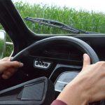 woman driving while using wipers